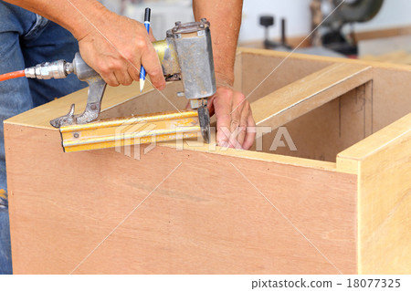 carpenter used air-gun for make new furniture carpenter used air-gun for make new furniture 18077325