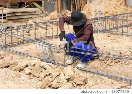 worker prepare steel rod for construction job worker prepare steel rod for construction job 18077869