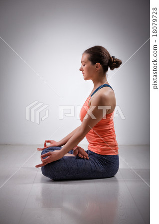 Woman meditate in yoga asana Padmasana Lotus pose 18079728