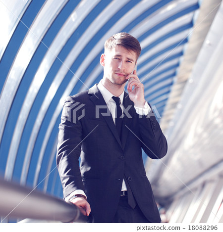 Businessman talking on phone Businessman talking on phone 18088296
