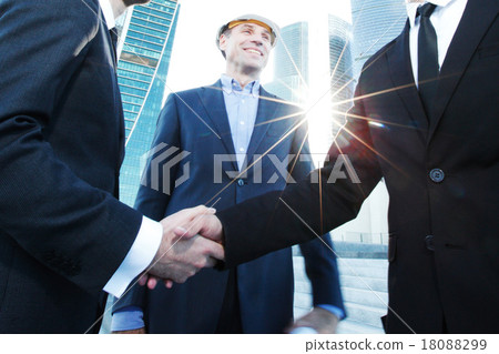 Investor and contractor shaking hands Investor and contractor shaking hands 18088299