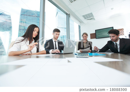 Business people working together at a meeting Business people working together at a meeting 18088300