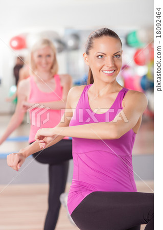 Attractive fit girls are exercising in gym Attractive fit girls are exercising in gym 18092464