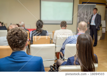 people listens to the acting in a conference hall 18094503
