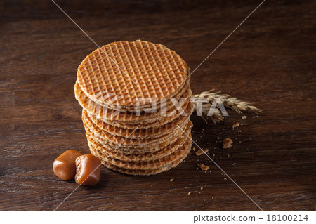 Waffles with caramel on wood 18100214