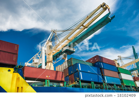 port crane unloads freight cargo ship with contain 18102409