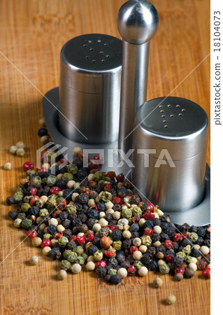 peppercorns on a wooden board peppercorns on a wooden board 18104073