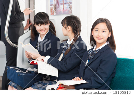 Junior high school girl studying in the train 18105813