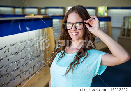 Pretty woman shopping for new glasses Pretty woman shopping for new glasses 18112392
