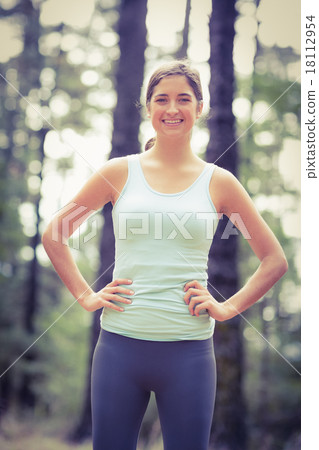 Young happy jogger standing Young happy jogger standing 18112954