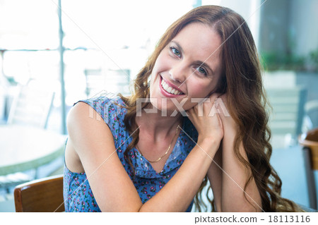 Pretty brunette smiling at camera Pretty brunette smiling at camera 18113116