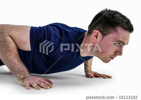 A fit man doing push ups 18113282