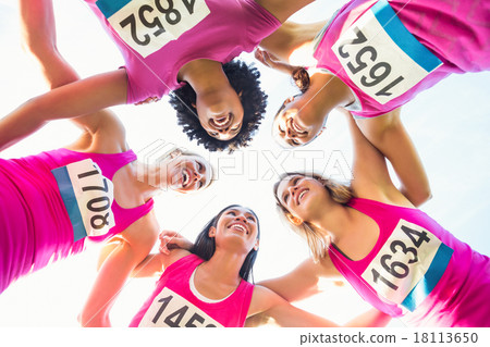 Five smiling runners supporting breast cancer marathon 18113650