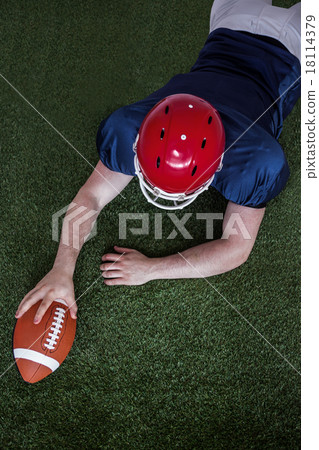 American football player scoring a touchdown 18114379