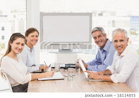 Smiling business people having a meeting Smiling business people having a meeting 18114855