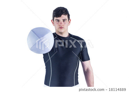 Rugby player handing a rugby ball 18114889