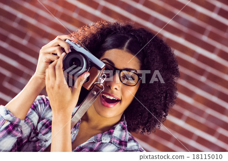 Attractive hipster photographing with camera Attractive hipster photographing with camera 18115010