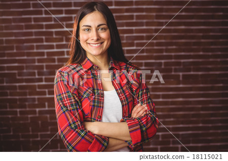 Beautiful hipster smiling at camera Beautiful hipster smiling at camera 18115021