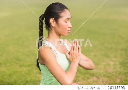 Peaceful sporty woman doing yoga Peaceful sporty woman doing yoga 18115393