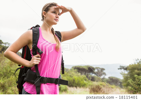 Blonde hiker looking for path Blonde hiker looking for path 18115401