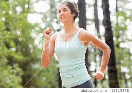 Happy jogger running and listening to music Happy jogger running and listening to music 18115458