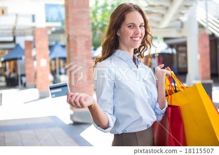 Pretty woman shopping at the mall with card 18115507