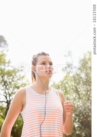Blonde athlete jogging on trail 18115508