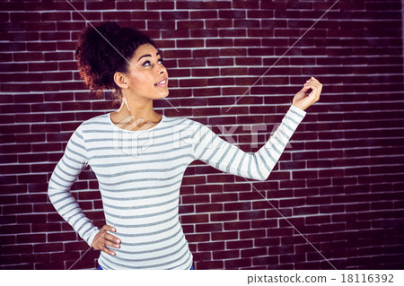 Young woman gesturing 18116392
