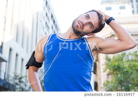 Handsome athlete stretching his head Handsome athlete stretching his head 18116457