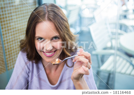 Pretty brunette enjoying chocolate dessert Pretty brunette enjoying chocolate dessert 18116468