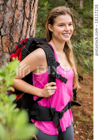 Smiling blonde hiker with backpack 18117238