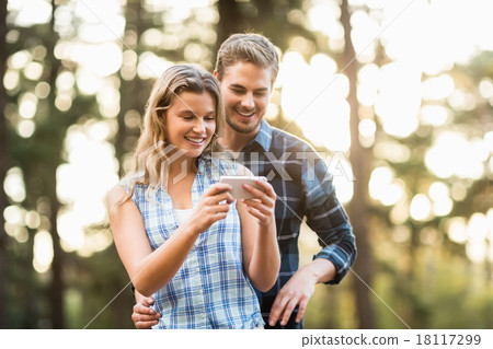 Happy smiling couple looking at pictures 18117299