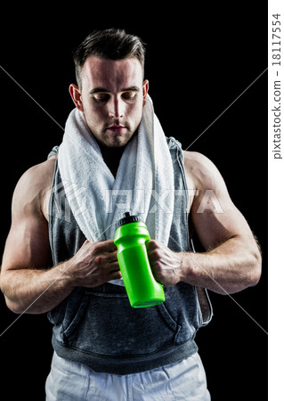 Handsome bodybuilder with towel and bottle Handsome bodybuilder with towel and bottle 18117554