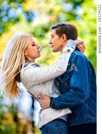 Young couple hugging and flirting in  park. 18124222