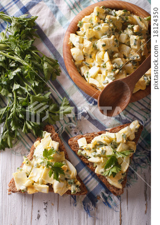 bread and egg salad close-up. Vertical top view bread and egg salad close-up. Vertical top view 18124350