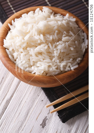 rice in a wooden bowl closeup. vertical 18124706