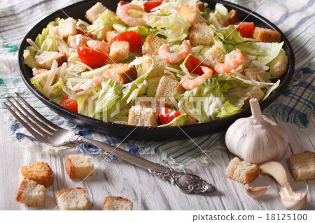 Caesar salad with shrimp and tomatoes closeup Caesar salad with shrimp and tomatoes closeup 18125100