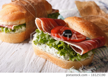 Sandwiches with ham, cream cheese and vegetables 18125190