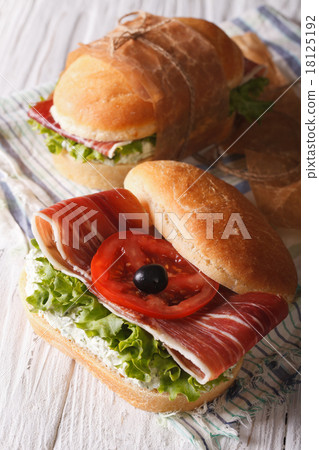 Sandwiches with jamon, cheese and vegetables 18125192