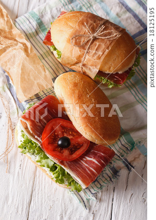 Sandwiches with prosciutto and vegetables top view 18125195
