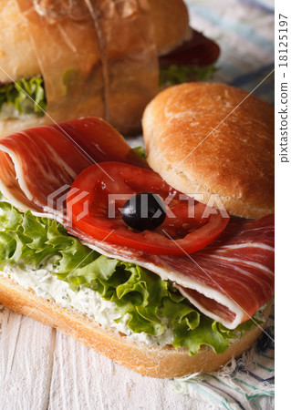 Sandwich with jamon, cheese and vegetables closeup 18125197