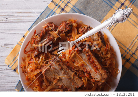 Stewed cabbage with pork ribs closeup top view Stewed cabbage with pork ribs closeup top view 18125291