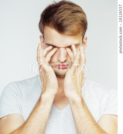 young handsome man on white background gesturing 18126557