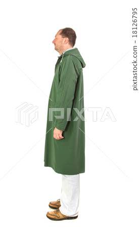 Man in rain green long coat. Man in rain green long coat. 18126795