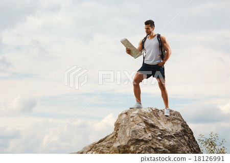 Hiker with a backpack 18126991