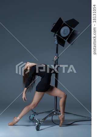 The beautiful ballerina posing on dack blue 18131054