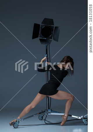 The beautiful ballerina posing on dack blue 18131058