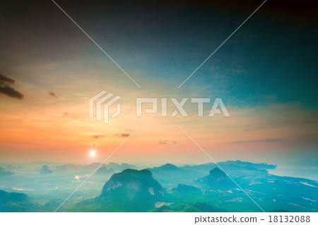 mountains under colorful sky in sunset 18132088