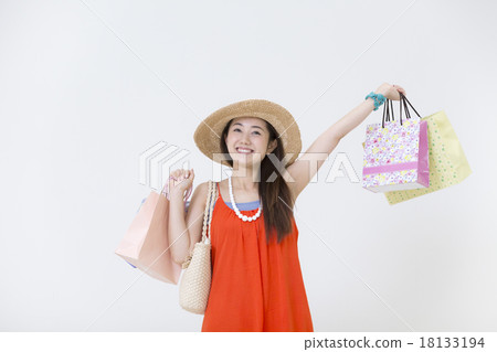 A woman with a shopping bag A woman with a shopping bag 18133194