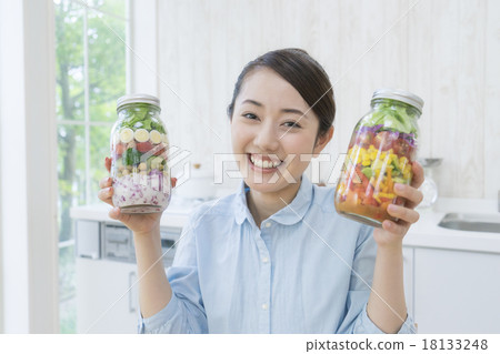 A woman with a jar salad A woman with a jar salad 18133248